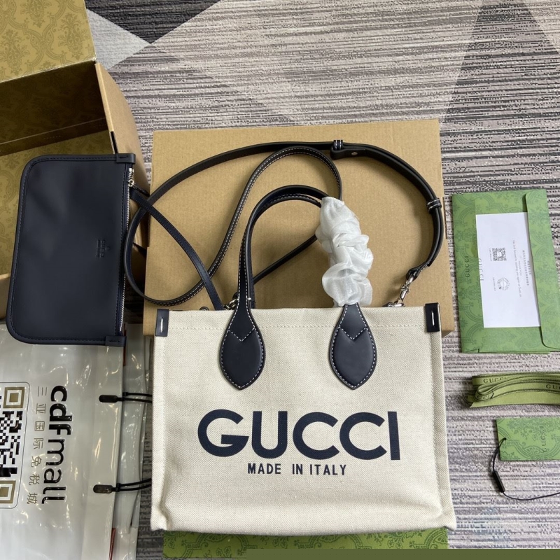 G*u*i shopping bags
